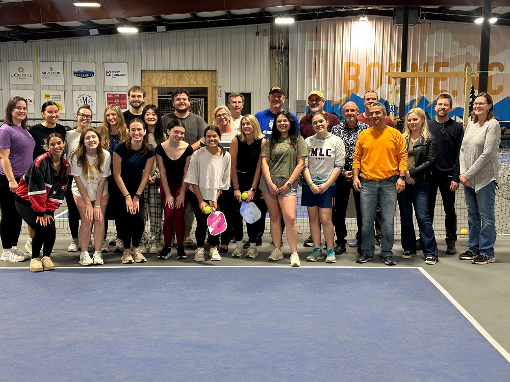 IOHRM students and faculty at the pickleball facility