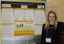 Woman presenting a research poster