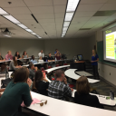 Lorin Farr giving a presentation to a full classroom of audience members